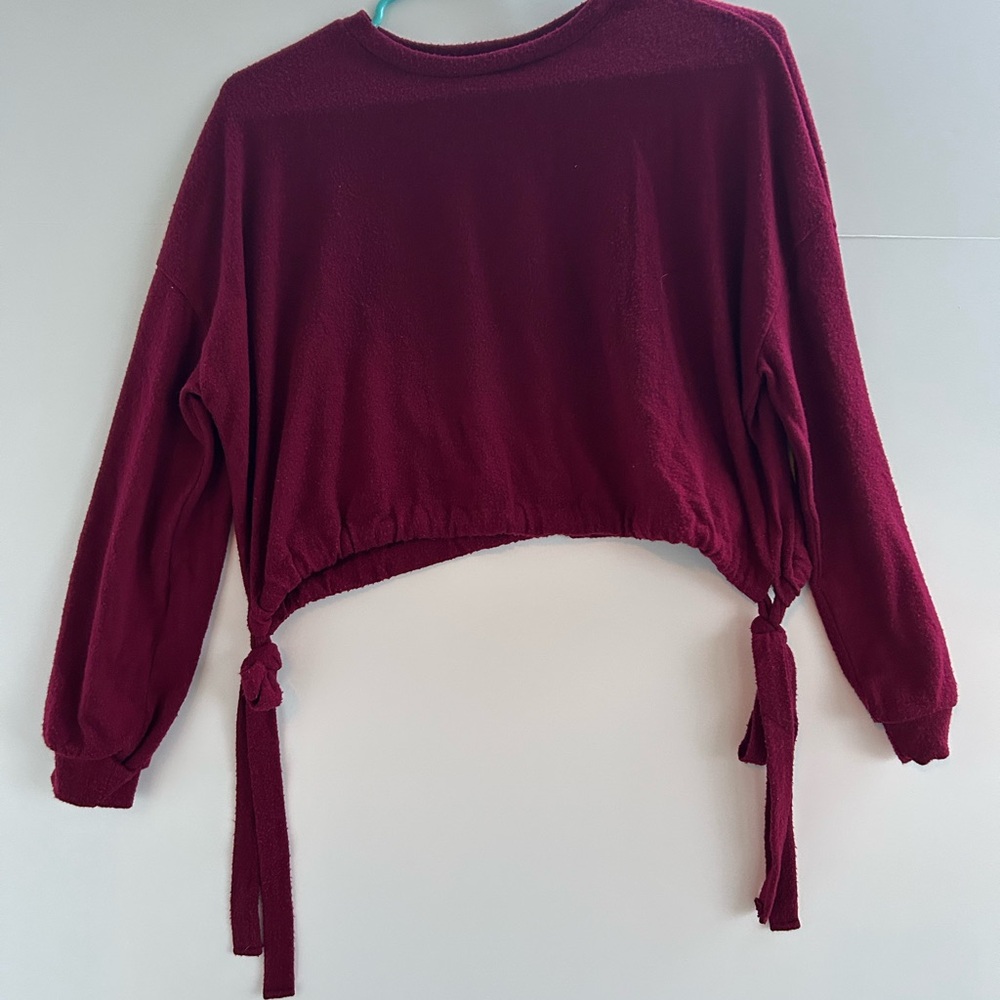 Red long sleeve crop sweatshirt with crew neck and tie front